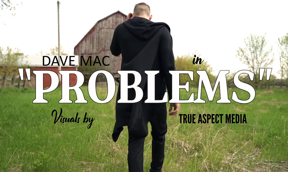 Screenshot of Dave Mac walking away from the camera in his video for the single Problems.