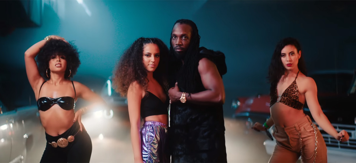 MelXdie and Mavado pose together in a scene from the Girls R Better music video.