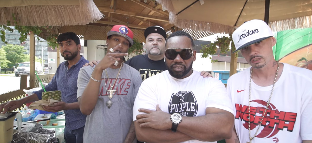 A screenshot from the Risk It All video featuring YH, Turk, and a cameo by Raekwon of Wu-Tang Clan.