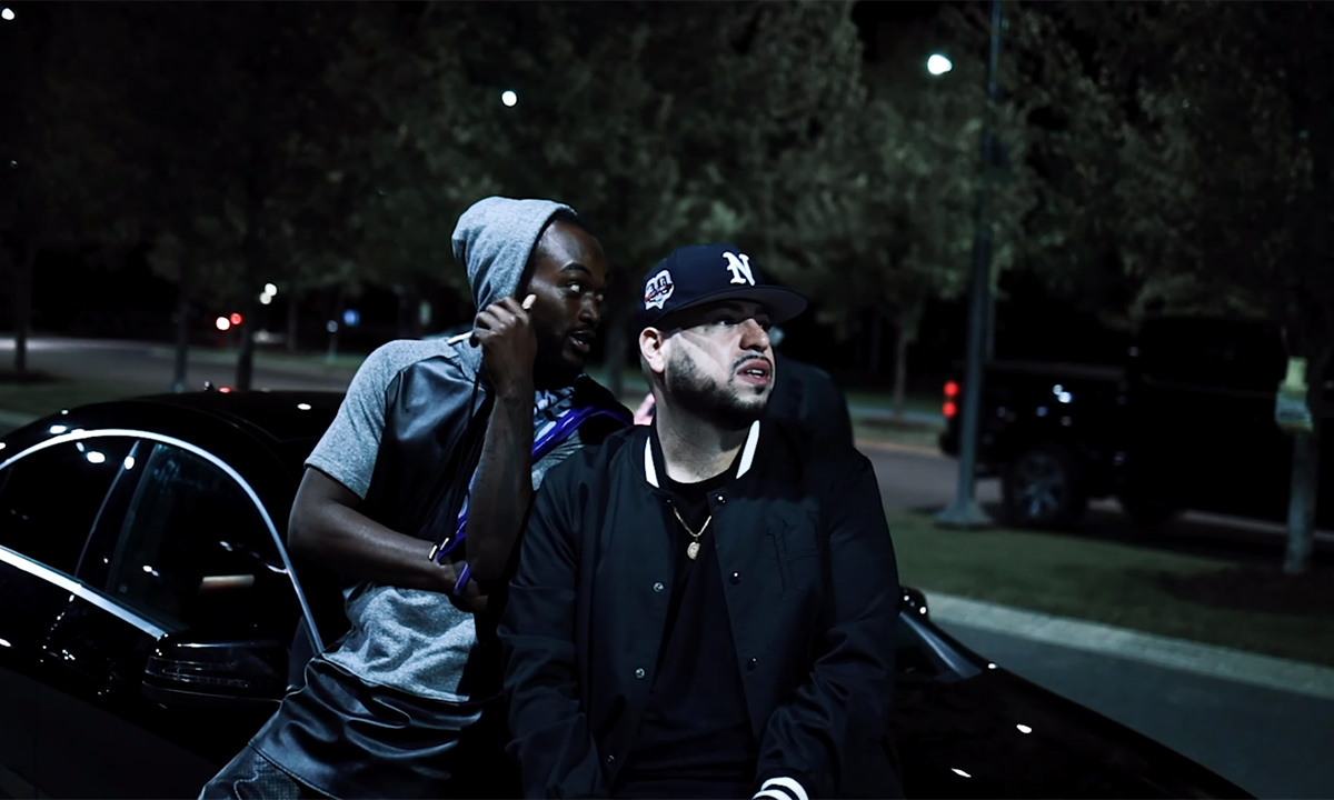 big ZEE standing outside in front of a car in his new video for Pure.