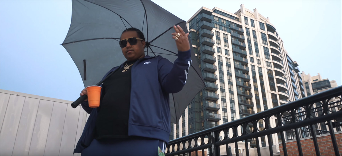 Toronto rapper Vanauley Stacks standing on a rooftop in his new video for Idiots.