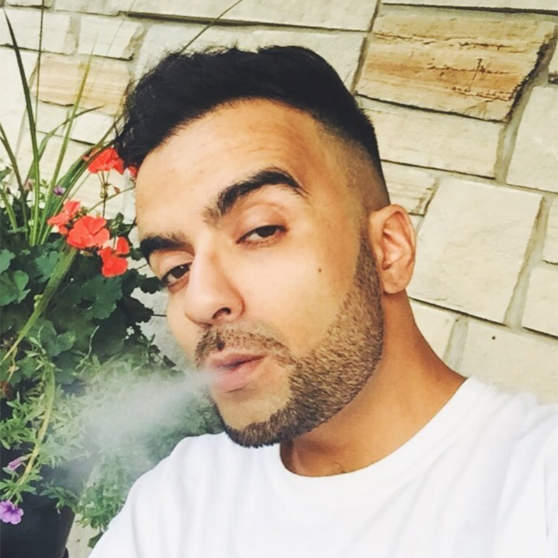 Photo of Toronto producer Vokab blowing smoke