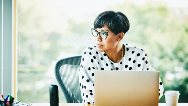 A businesswoman works on a laptop (Photo: Thomas Barwick/DigitalVision via Getty Images)