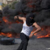 A Palestinian protester uses a slingshot during clashes with Israeli soldiers (Photo: AP Photo/Nasser Nasser)