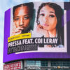 Pressa and Coi Leray are featured on a billboard in Toronto