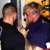 Jake Paul is pushed into a closet to get him away from boxer Floyd Mayweather Jr. after a scuffle broke out during a news conference. (Photo: AP Photo/Marta Lavandier)