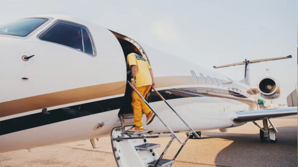 Russ boards a private jet in the video for Sheep