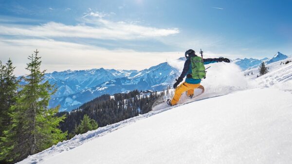 A snowboarder slides down a slope (Photo: Yulkapopkova/E+ via Getty Images)