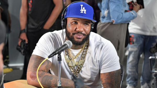 The Game wearing a blue LA Dodgers hat while doing an interview