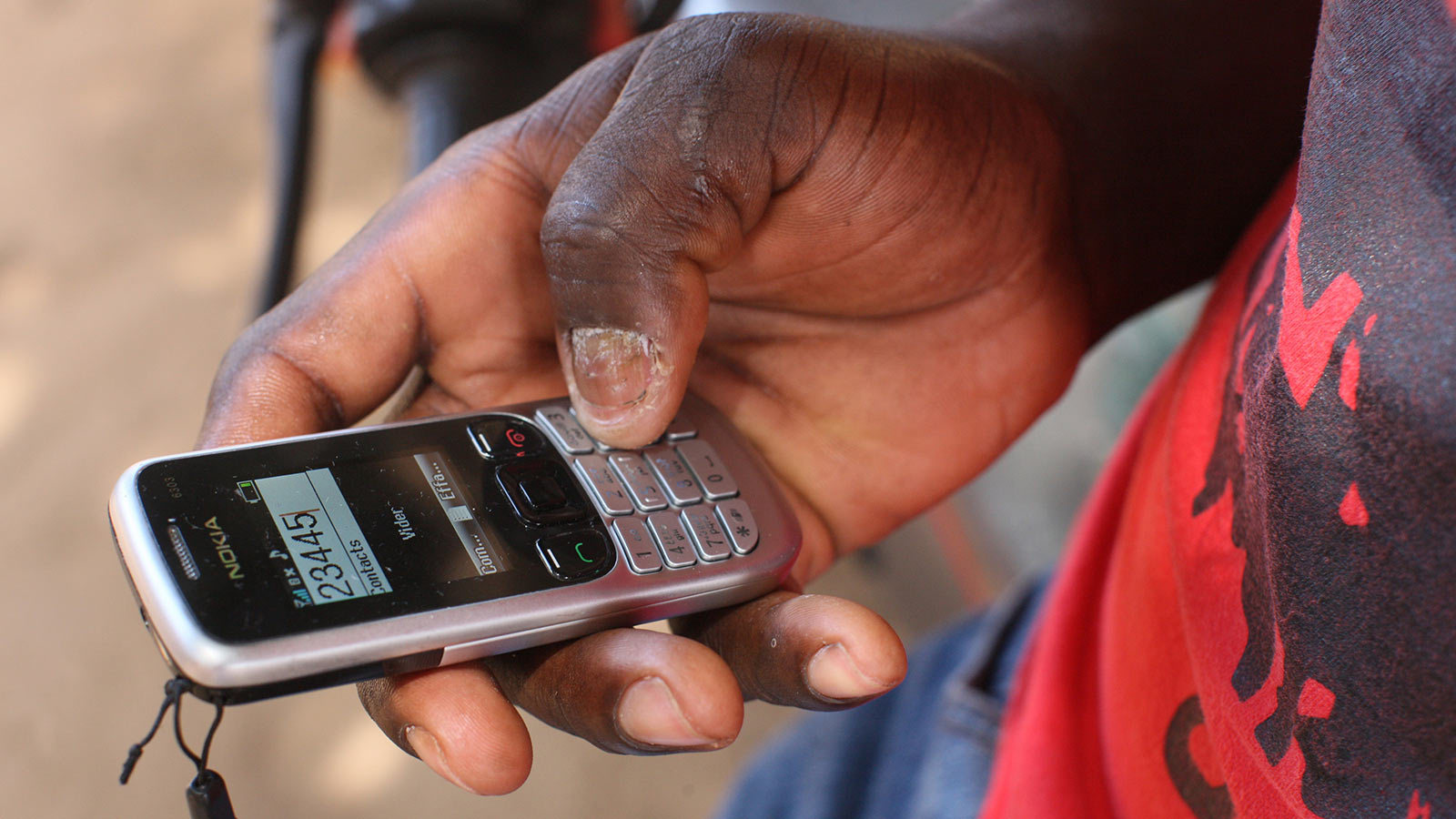 An older mobile phone being used in Togo (Photo: Godong/Universal Images Group via Getty Images)