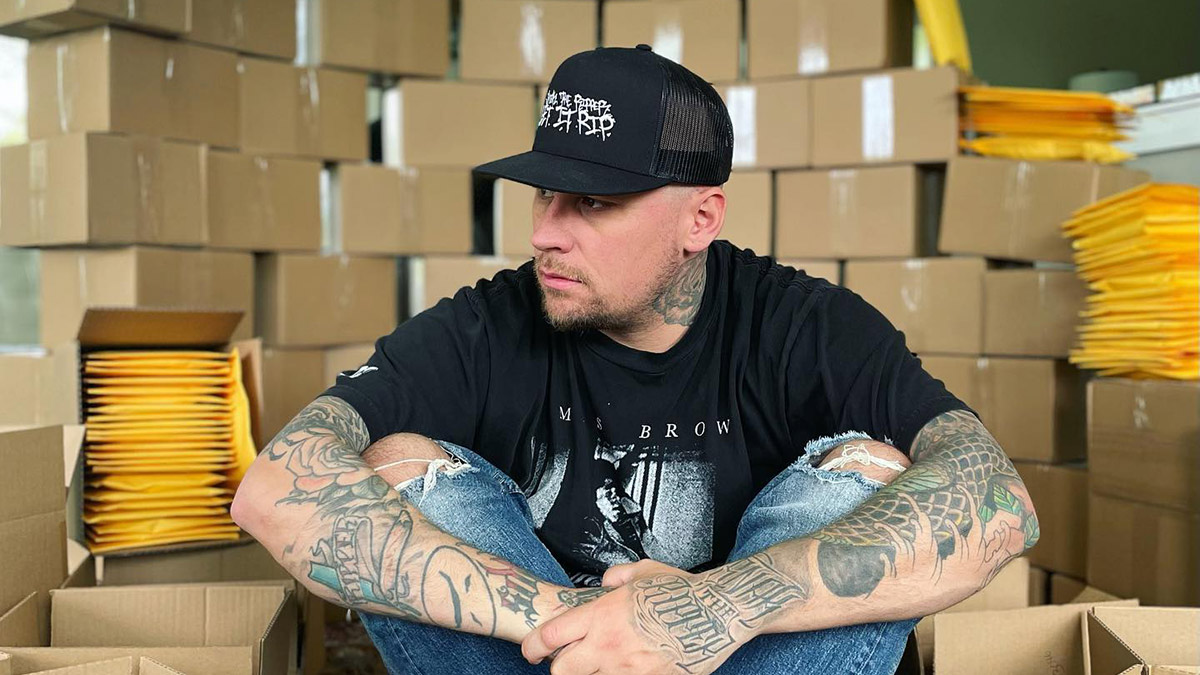 Snak The Ripper with packages containing his new album