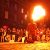 A street performer breathing fire
