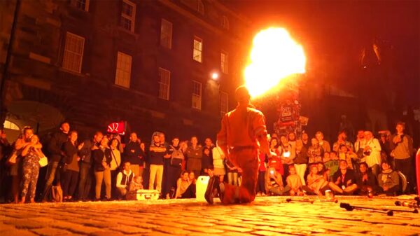 A street performer breathing fire
