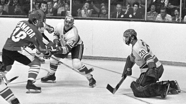 Paul Henderson shooting on goalie Vladislav Tretiak during the 1972 Summit Series.