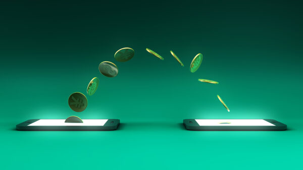 A art concept depicting digital money transferring from one mobile device to another