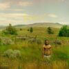 Dom Vallie stands shirtless in an open field for the Are We There Yet? artwork