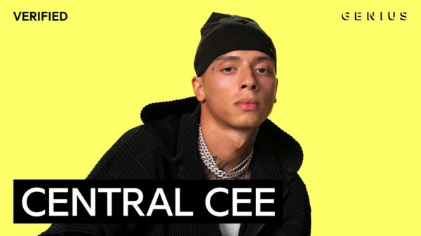 Central Cee wearing a black hoodie and hat on Genius