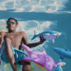 Ralan Styles sits on a pool floatie in the Baby Shark video