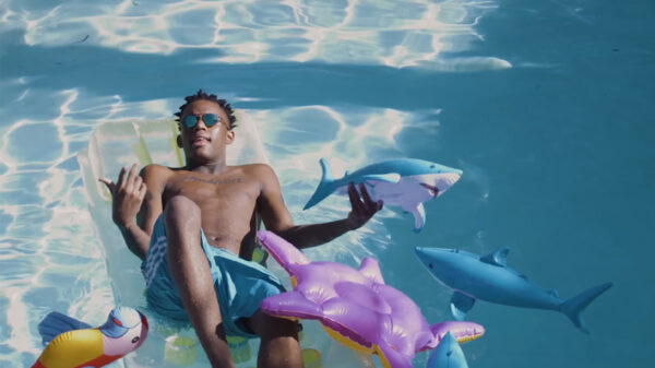 Ralan Styles sits on a pool floatie in the Baby Shark video