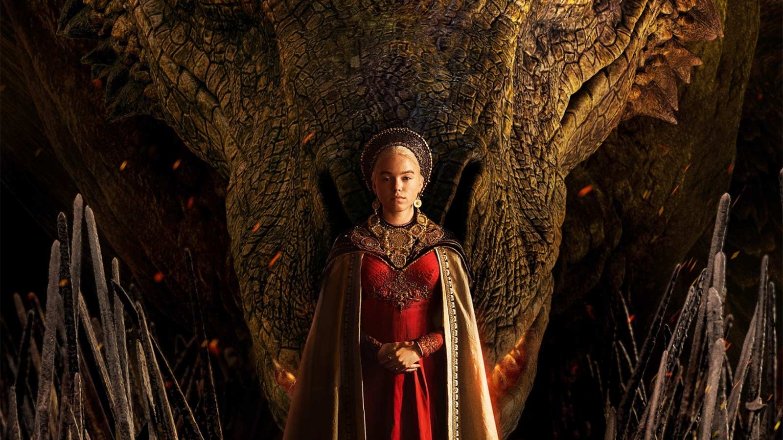 A young woman stands in front of a large Dragon head