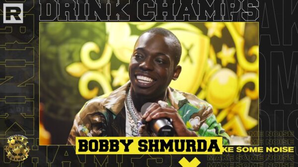 Promotional poster for Bobby Shmurda on Drink Champs, with a screengrab of Bobby smiling while holding the microphone