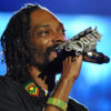 A man holds a diamond encrusted microphone Snoop Dogg (Photo: Jason Persse/CC-BY-SA-2.0)