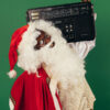 A Black Santa Claus holding a boombox
