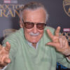 Stan Lee poses on the red carpet for the movie Doctor Strange in 2016.