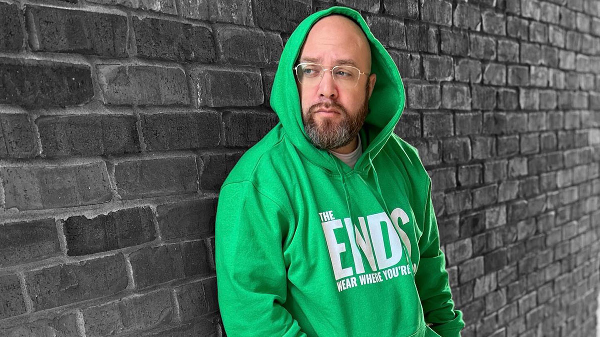 The Ends CEO Bishop Brigante wearing a green hoodie made by the company