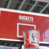 A basketball net at KFCourt with Buckets Are Life written on the backboard