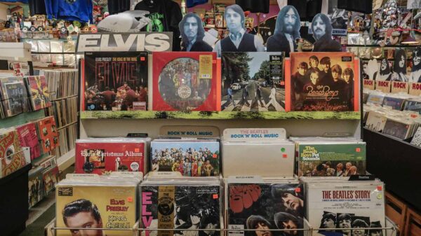 Record store racks full of Elvis, Beach Boys and The Beatles vinyl records