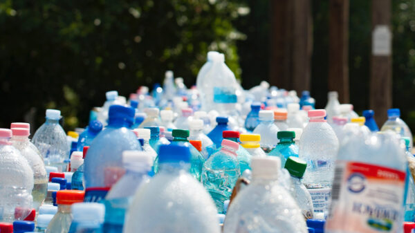 A large group of water bottles from various companies