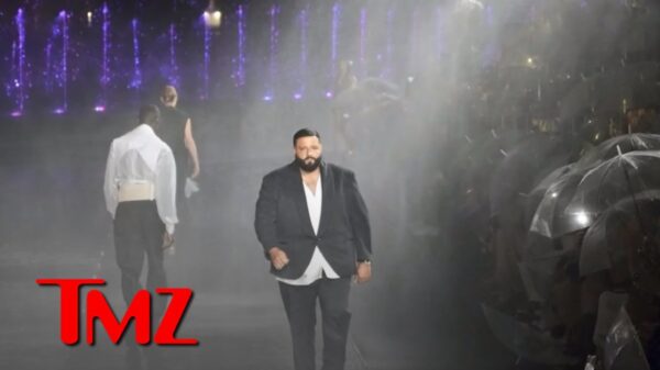 DJ Khaled makes his runway debut as the audience watches on.