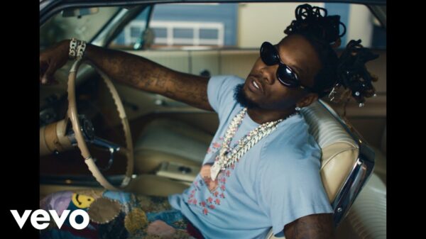 Offset behind the wheel with sunglasses on in the JEALOUSY video