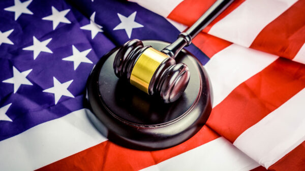 A gavel resting on an American flag