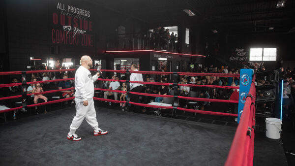 Bishop Brigante performing inside a boxing ring.