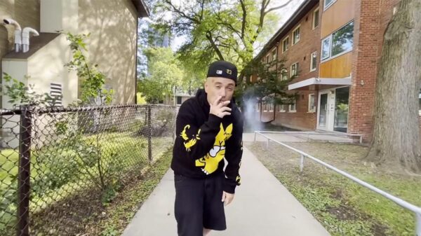 Noah23 smokes a joint in the Tiger Cage music video