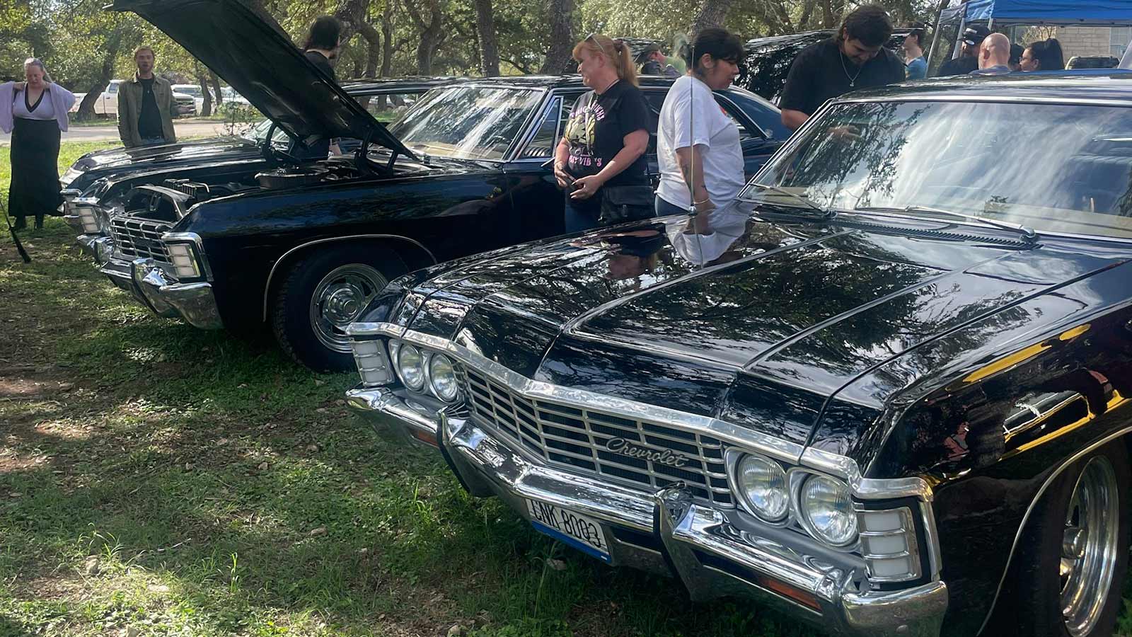 A gathering of enthusiasts of 1967 Impalas