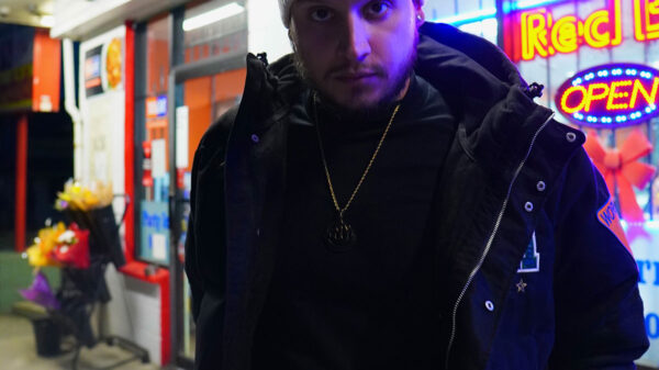 Rapper Kresnt poses for the camera outside of a store to promote his new album GOOD SPIRITS.