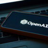 The OpenAI logo on a mobile phone screen.