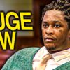 Rapper Young Thug dressed in a suit and tie during a court proceeding.