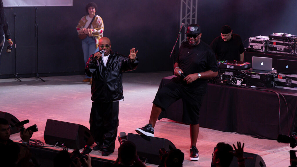 Jermaine Dupri holds a microphone on stage at the Freaknik: The Wildest Party Never Told at SXSW 2024.
