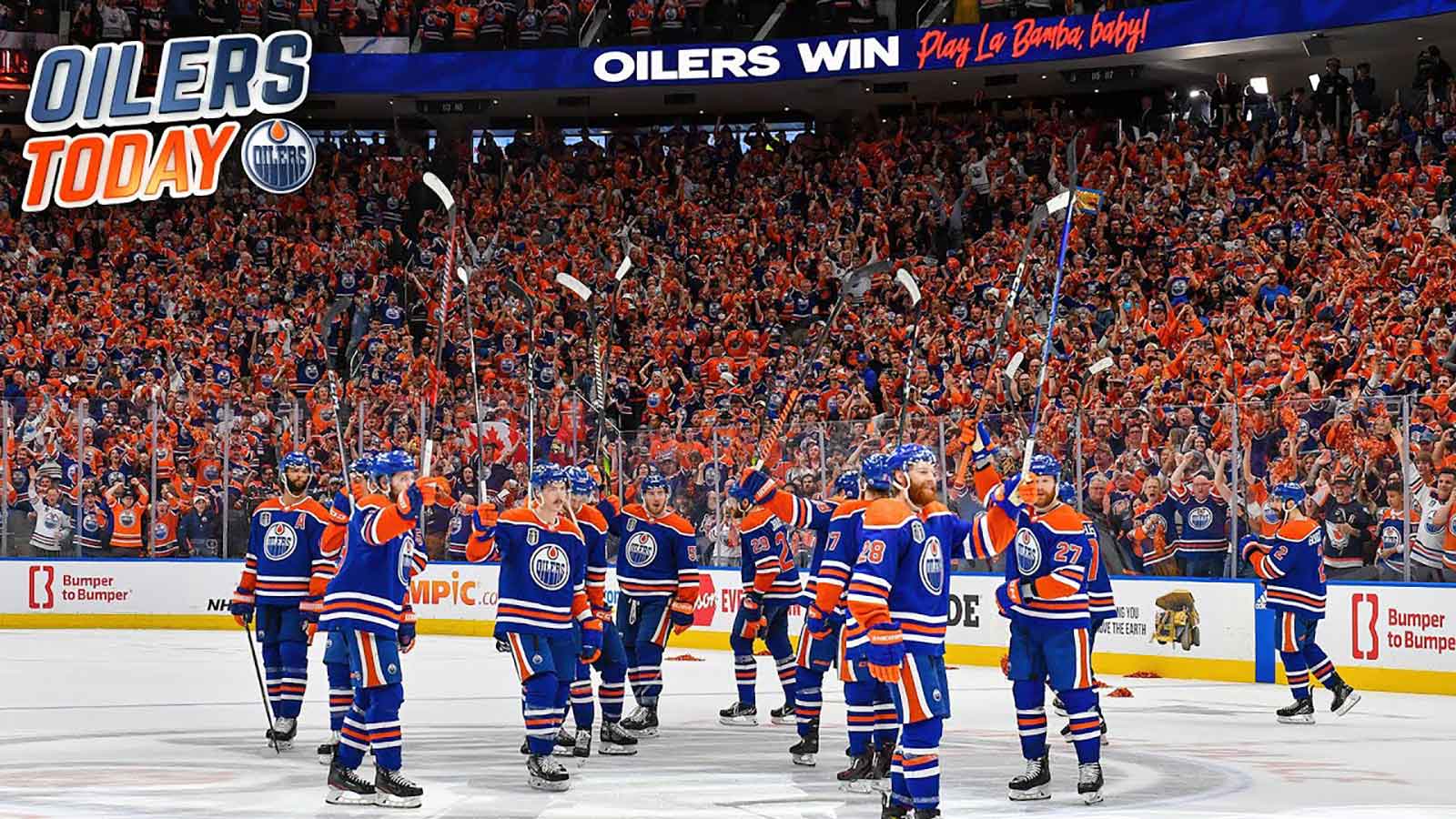 The Edmonton Oilers celebrate on ice after a win.