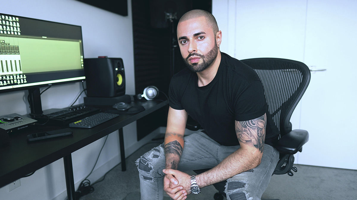 Dillin Hoox of Magic Records sits in front of a studio setup.