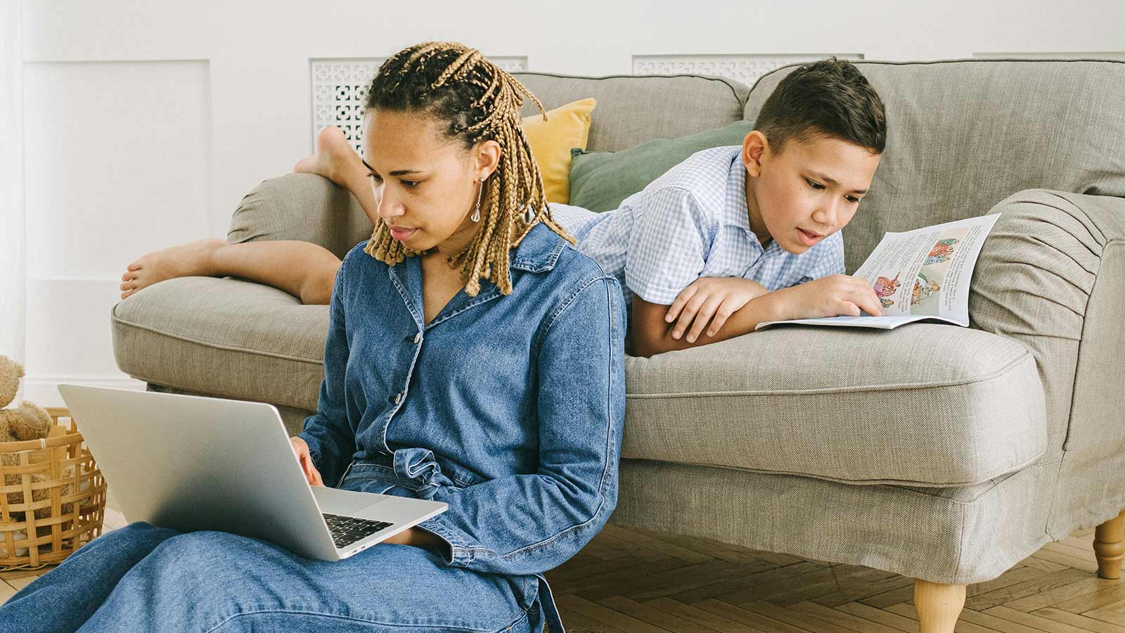 A child can be seen reading, to depict the concept of StoryWalk