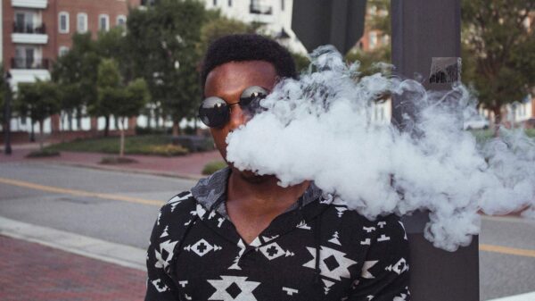 An image of a man vaping, for an article about strategies on how to quit.