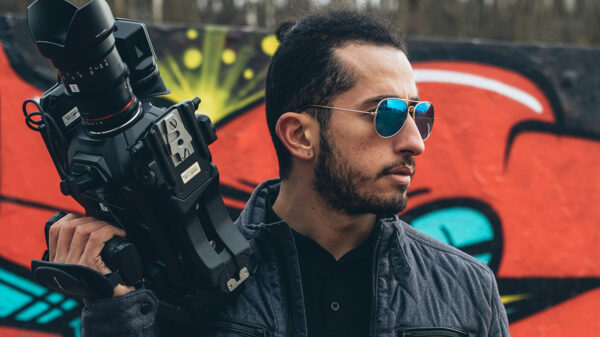 A man holding a video camera.