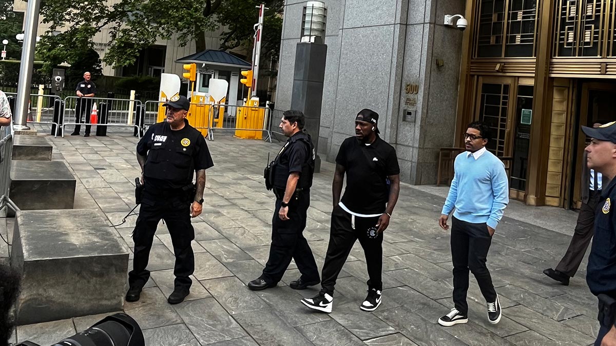 Police officers outside a courthouse