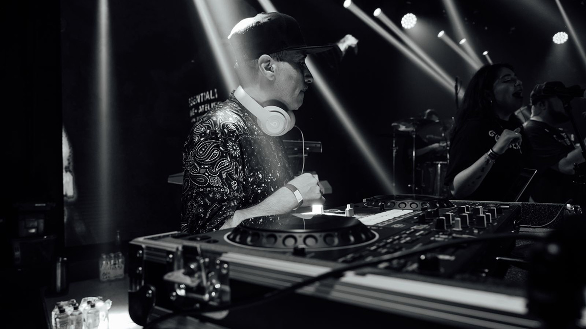 A black and white promotional image of DJ Kemo to support the interview.