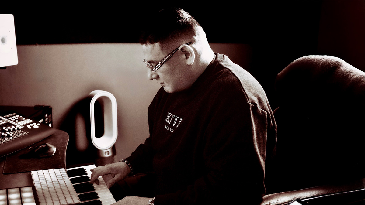 MoeZart, a producer from Vancouver, works on beats while sitting in front of equipment.